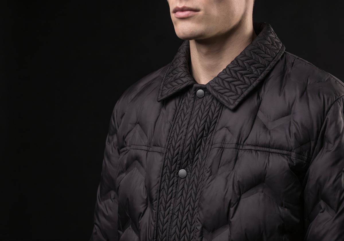 Velmurax men's quilted padded jacket in black, in a close detail shot on the model