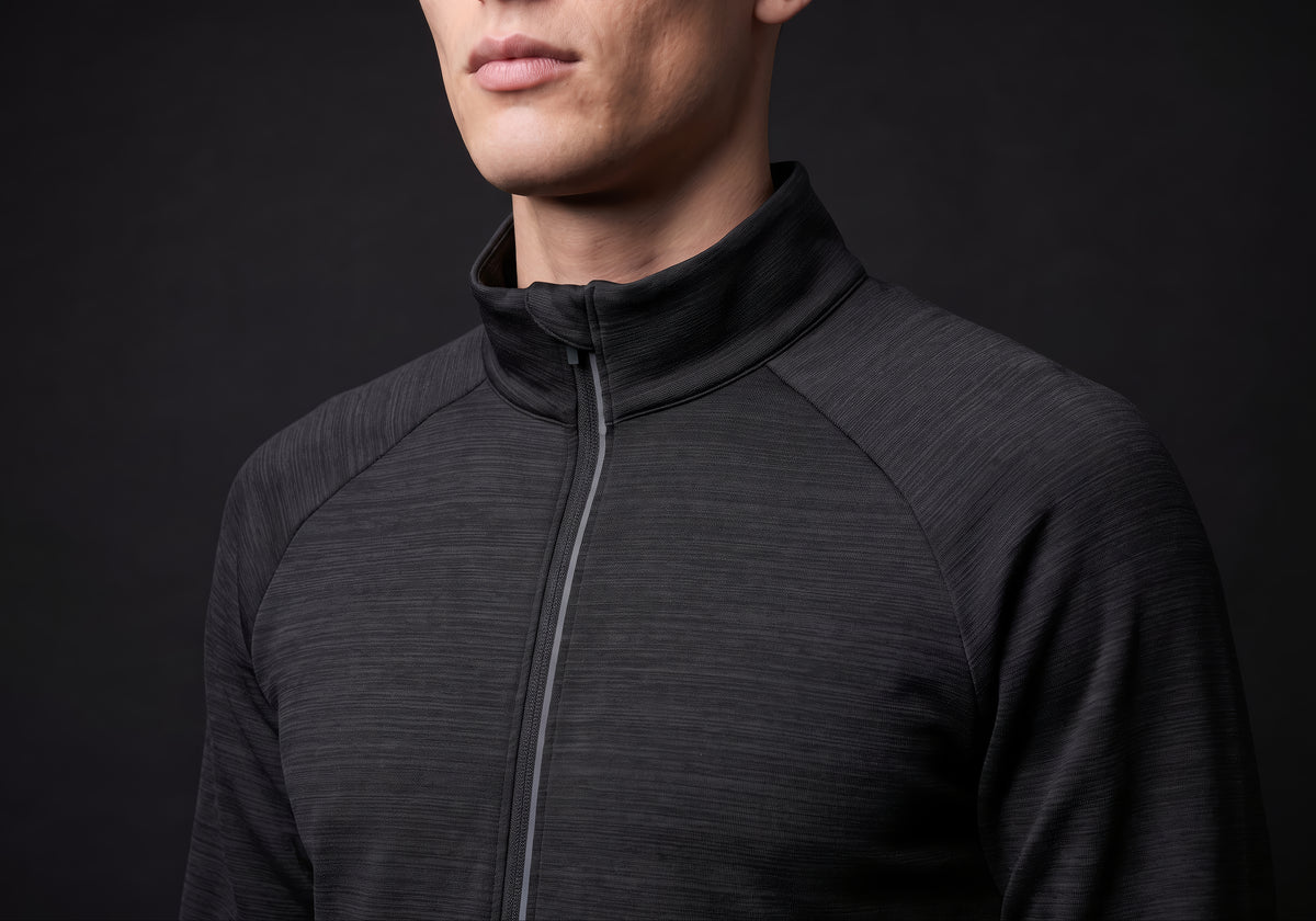 Velmurax men's stretch track jacket in black, in a close detail shot on the model