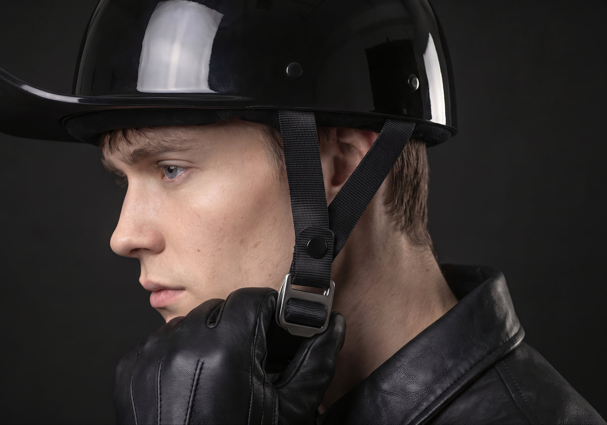 Velmurax baseball cap style helmet in gloss black, in a close detail shot on a rider