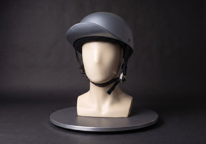 Velmurax baseball cap style helmet in gray, on a display mannequin on the studio turntable