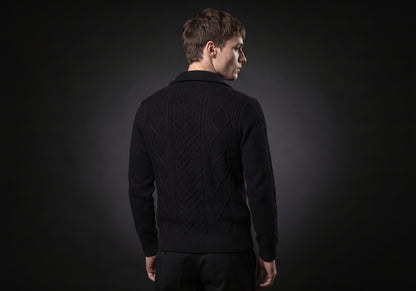 Velmurax cable knit zip cardigan in black, seen from the back on the model, showing the back of the garment