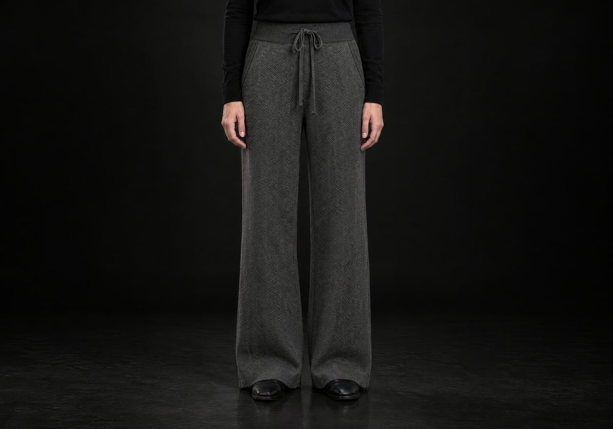 Velmurax Cashmere Wide-Leg Pants in charcoal with herringbone knit, ribbed waistband and drawstring, front view on a model