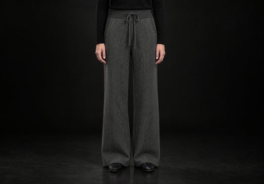 Velmurax Cashmere Wide-Leg Pants in charcoal with herringbone knit, ribbed waistband and drawstring, front view on a model