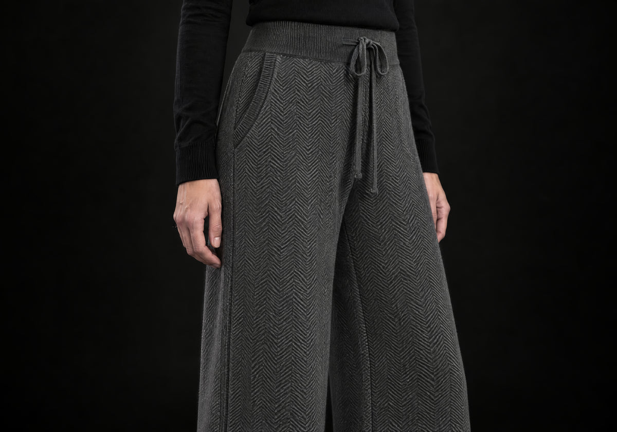 Velmurax Cashmere Wide-Leg Pants in charcoal, close-up of the herringbone knit, drawstring and ribbed waistband