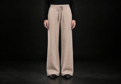 Velmurax Cashmere Wide-Leg Pants in camel with herringbone texture and tied drawstring waist, front view on a model