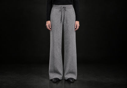 Velmurax Cashmere Wide-Leg Pants in gray with herringbone pattern, side pockets and wide legs, front view on a model