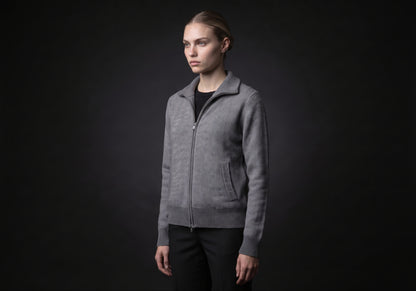 Velmurax cashmere zip cardigan in gray, in a three-quarter view on the model on the studio set