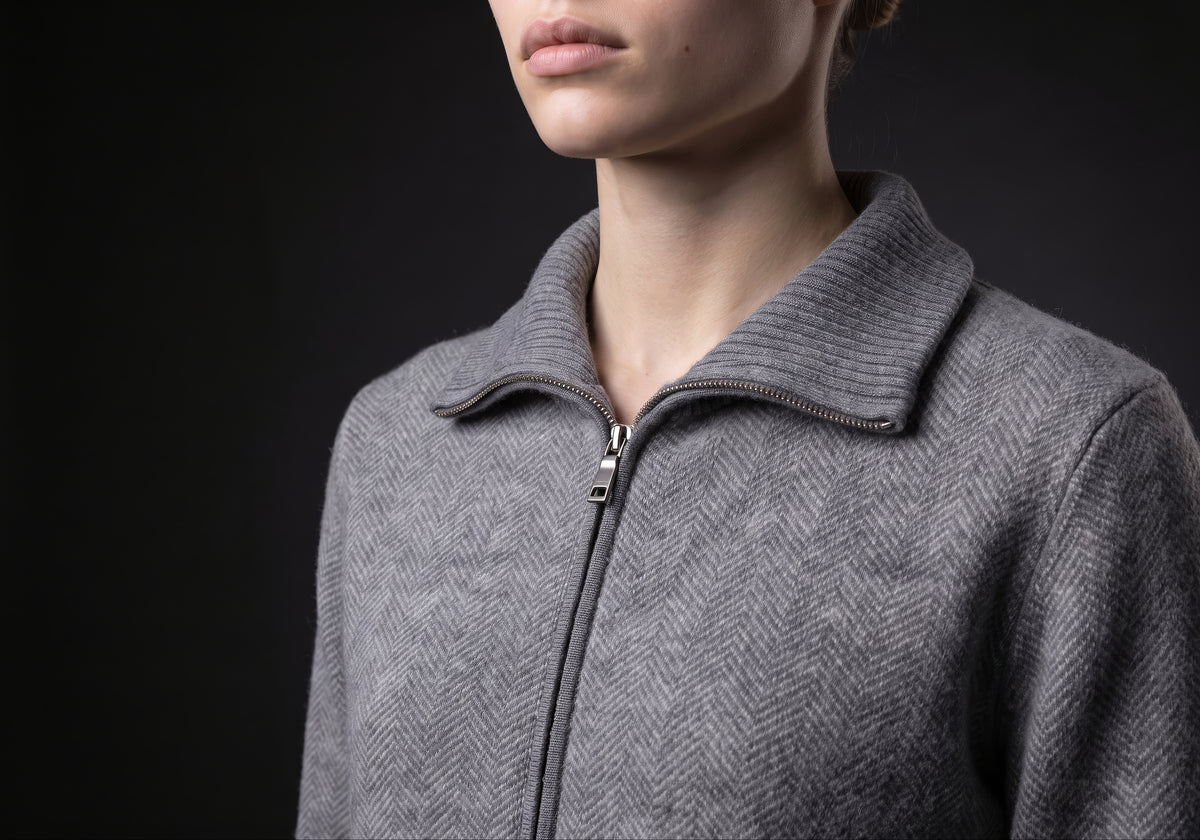 Velmurax cashmere zip cardigan in gray, in a close detail shot on the model