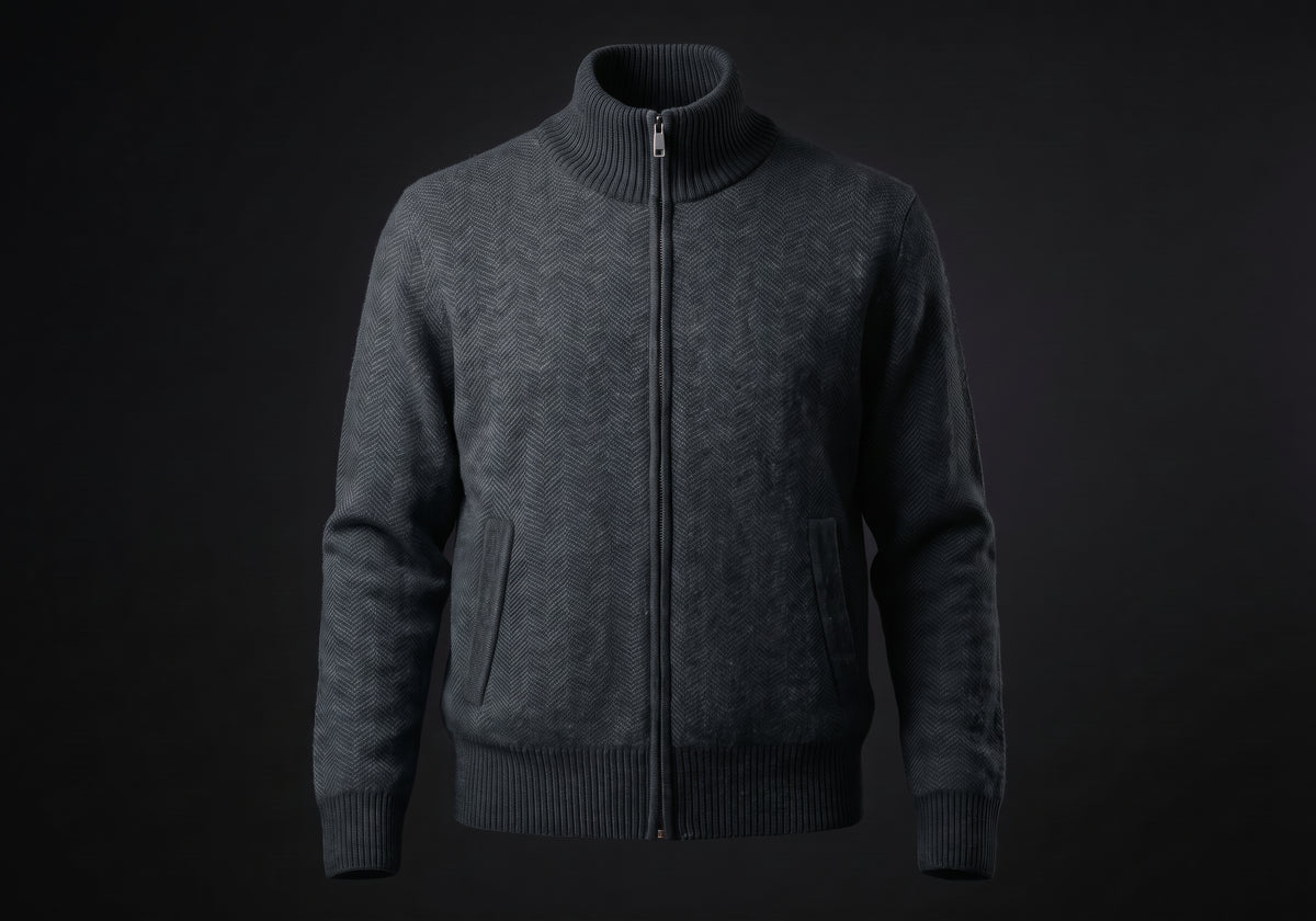 Velmurax cashmere zip cardigan in charcoal, on its own on the dark studio set