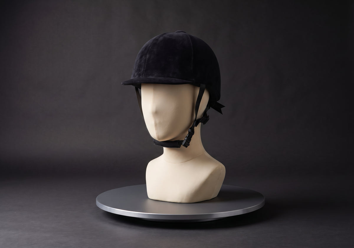 Velmurax classic velvet riding helmet in black, on a display mannequin on the studio turntable