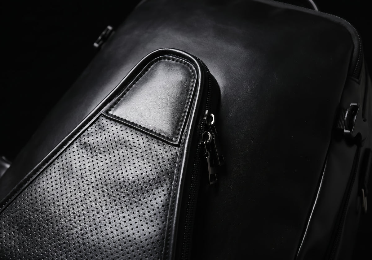 Velmurax equestrian backpack in black, the hardware and stitching up close
