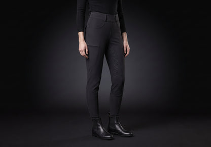 Velmurax fleece-lined winter riding pants in black, worn by a rider, seen from the ribcage down on the dark studio set