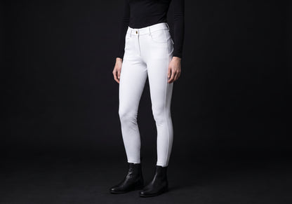 Velmurax full-seat riding breeches in white, worn by a rider, seen from the ribcage down on the dark studio set