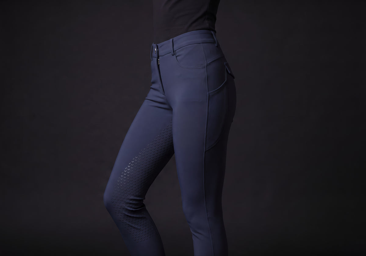 Velmurax full-seat riding breeches in navy, worn, in side profile