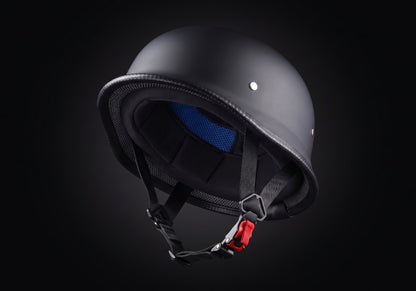 Velmurax German-style half helmet in matte black, tipped back to show the lining and chin strap