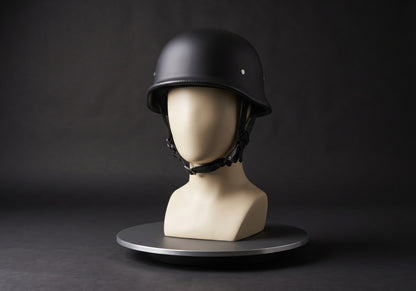 Velmurax German-style half helmet in matte black, on a display mannequin on the studio turntable