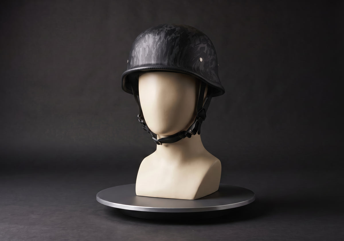 Velmurax German-style half helmet in forged black, on a display mannequin on the studio turntable