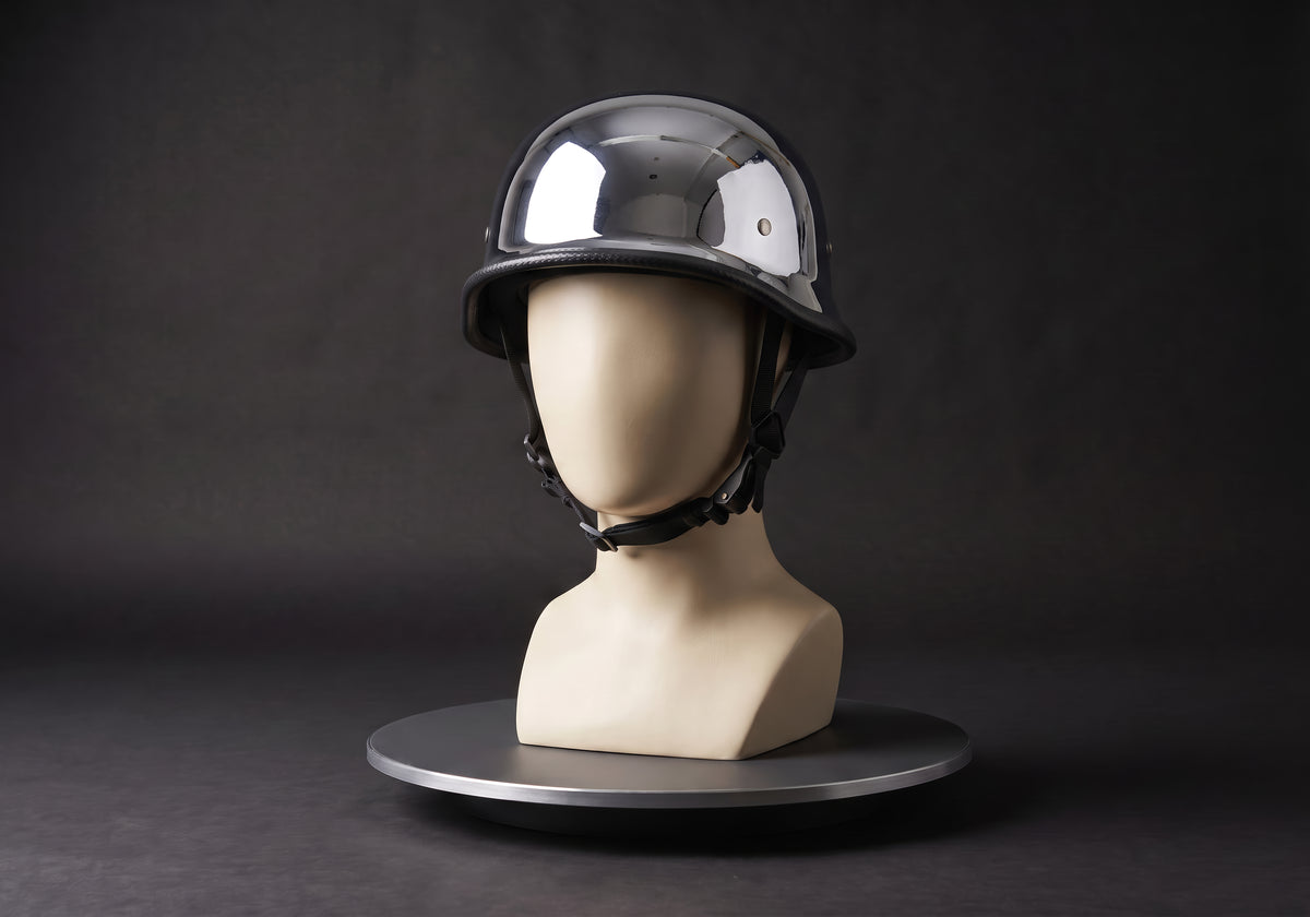 Velmurax German-style half helmet in chrome, on a display mannequin on the studio turntable