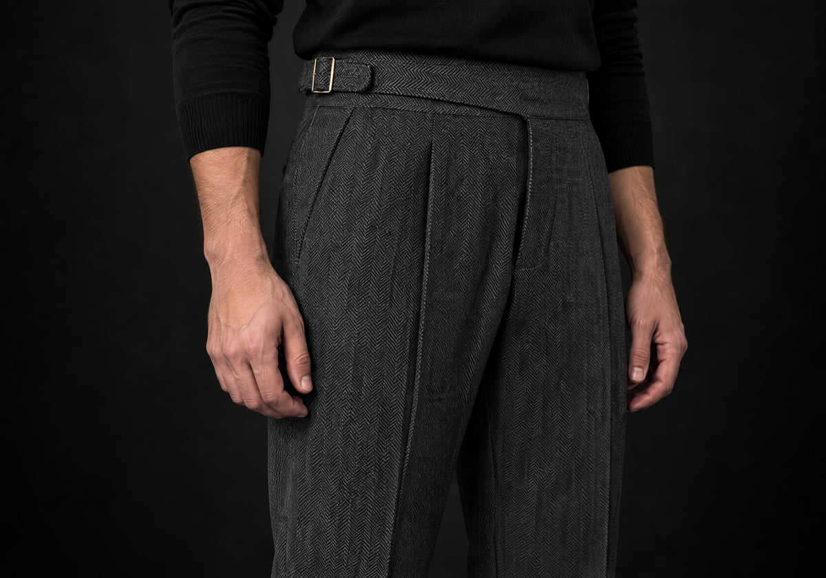 Velmurax Herringbone Wool-Blend Pants in dark gray, close-up of the herringbone weave, pleats and side buckle tab