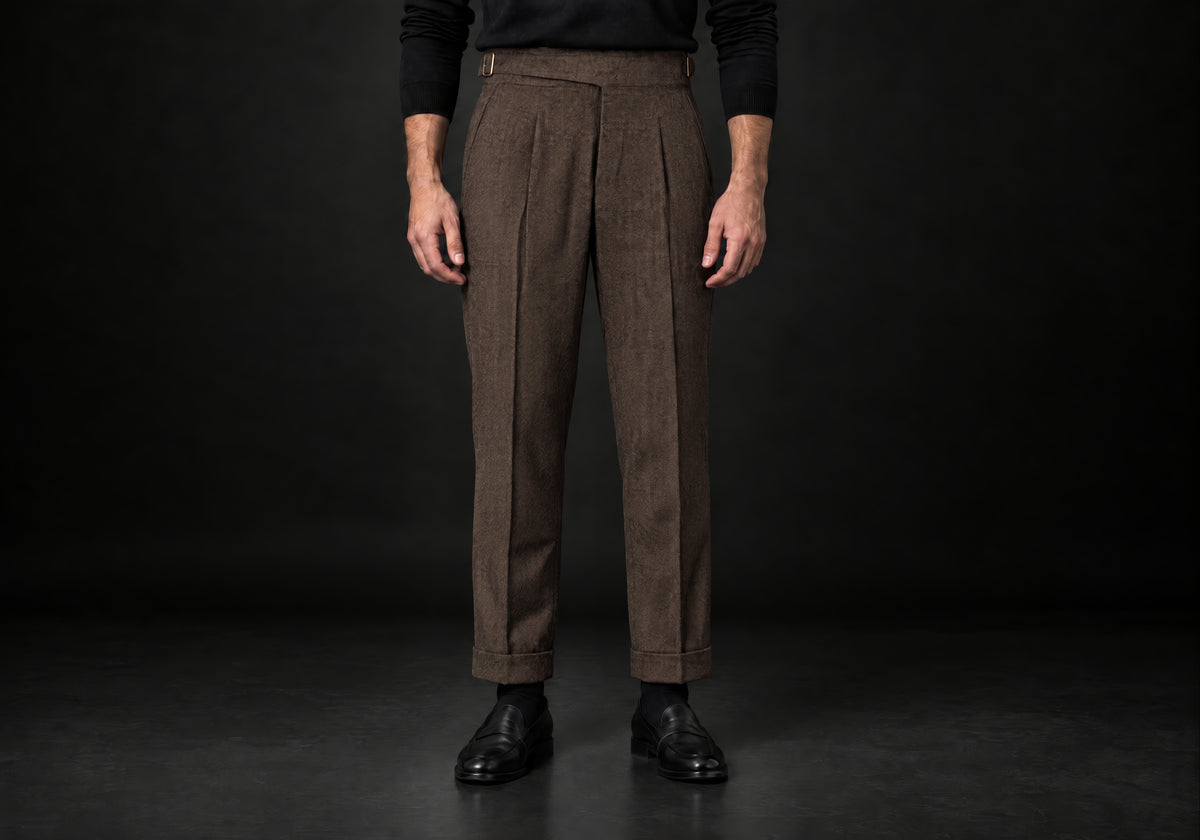 Velmurax Herringbone Wool-Blend Pants in brown with front pleats and side buckle tabs, front view on a model