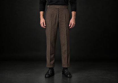Velmurax Herringbone Wool-Blend Pants in brown with front pleats and side buckle tabs, front view on a model