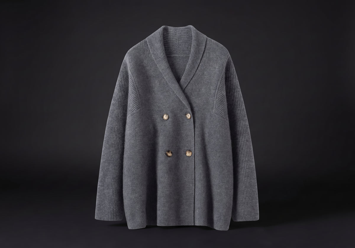 Velmurax knit cashmere coat in dark gray, on its own on the dark studio set