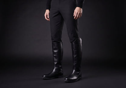Velmurax men's knee-high riding boots in black, worn by a rider with breeches tucked in
