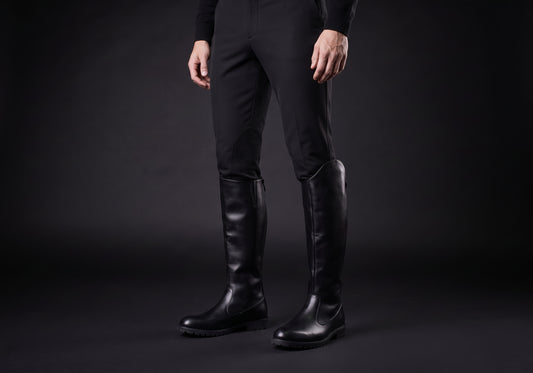 Velmurax men's knee-high riding boots in black, worn by a rider with breeches tucked in