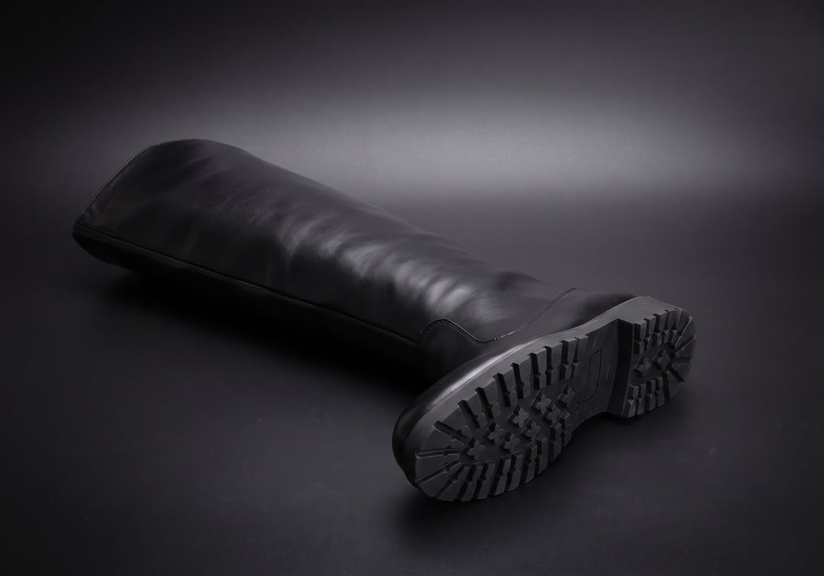 Velmurax men's knee-high riding boots in black, showing the outsole and heel