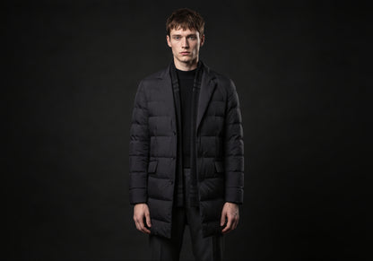 Velmurax men's quilted down coat in black, worn by the model in a front view on the dark studio set