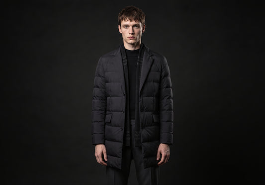 Velmurax men's quilted down coat in black, worn by the model in a front view on the dark studio set