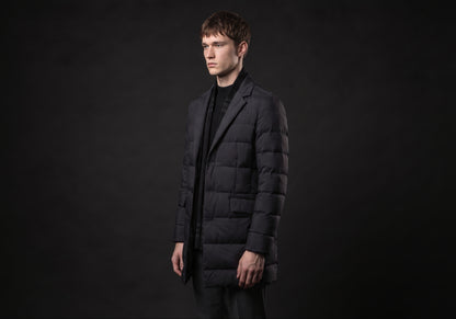 Velmurax men's quilted down coat in black, in a three-quarter view on the model on the studio set