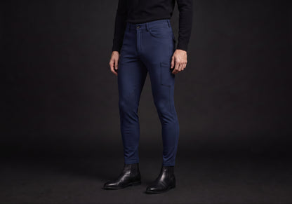 Velmurax men's riding breeches in navy, worn by a rider, seen from the ribcage down on the dark studio set