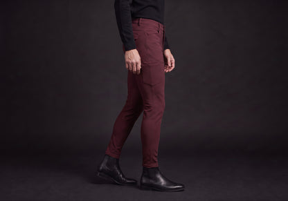 Velmurax men's riding breeches in burgundy, worn, in side profile