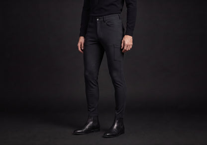 Velmurax men's riding breeches in black, worn by a rider, seen from the ribcage down on the dark studio set