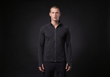 Velmurax men's stretch track jacket in black, worn by the model in a front view on the dark studio set
