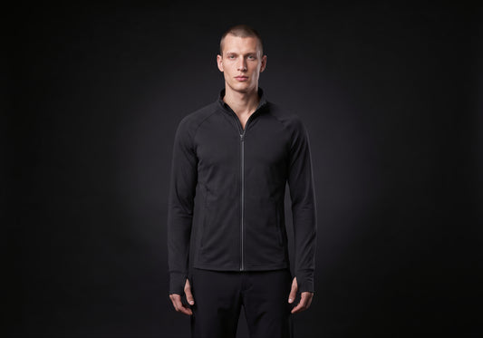 Velmurax men's stretch track jacket in black, worn by the model in a front view on the dark studio set