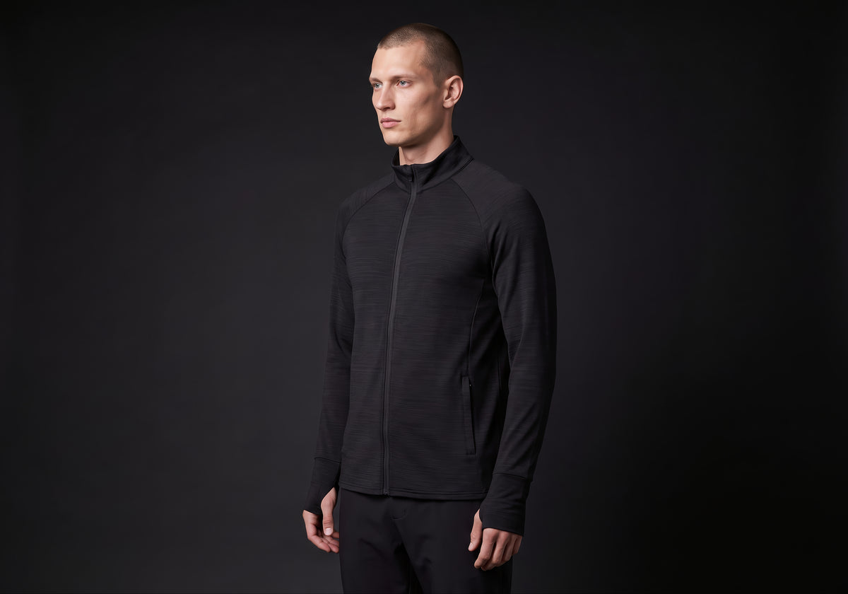 Velmurax men's stretch track jacket in black, in a three-quarter view on the model on the studio set