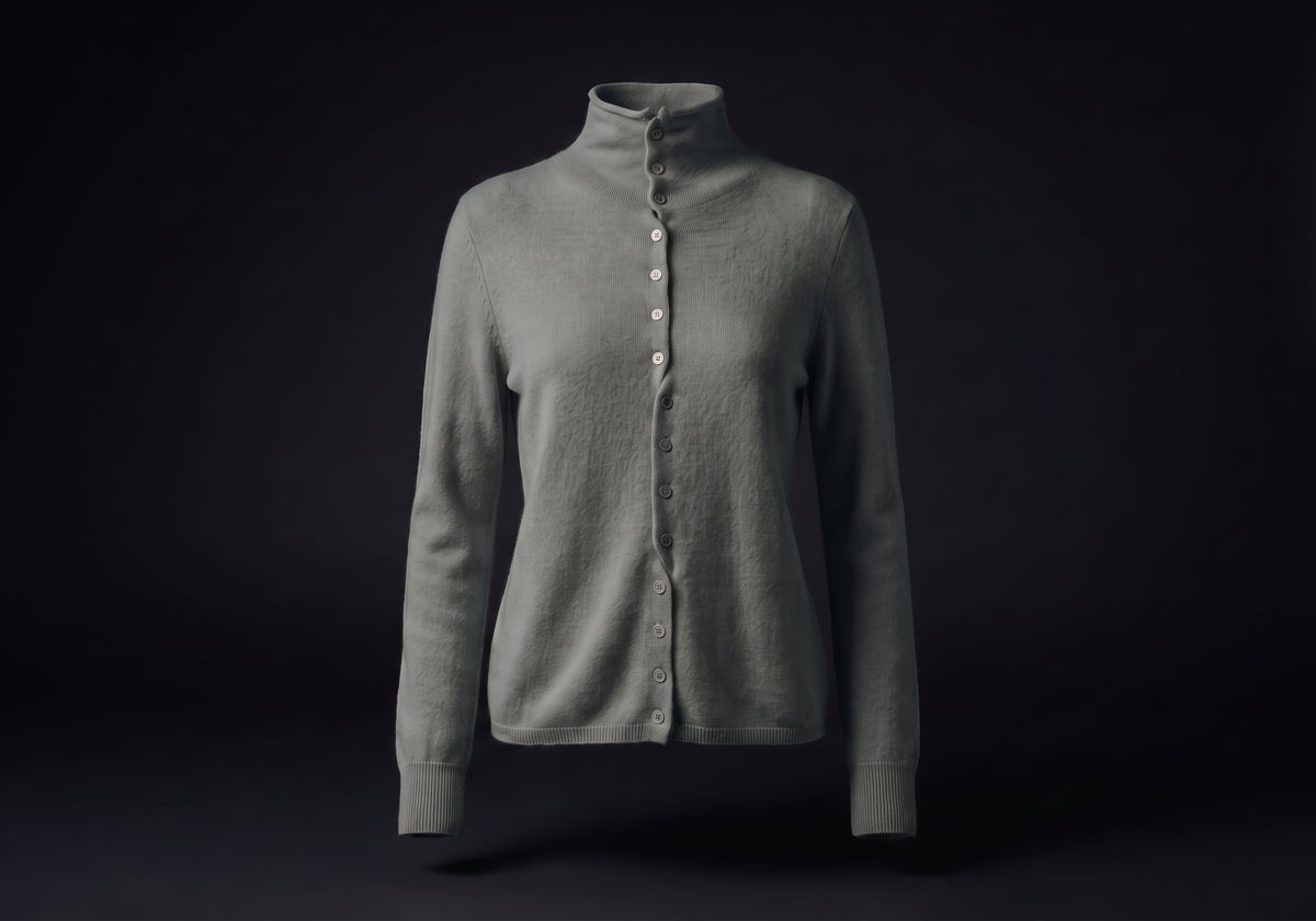 Velmurax mock neck cashmere cardigan in elephant gray, on its own on the dark studio set