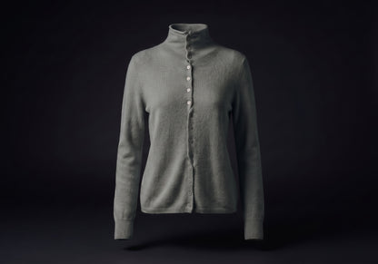 Velmurax mock neck cashmere cardigan in elephant gray, on its own on the dark studio set