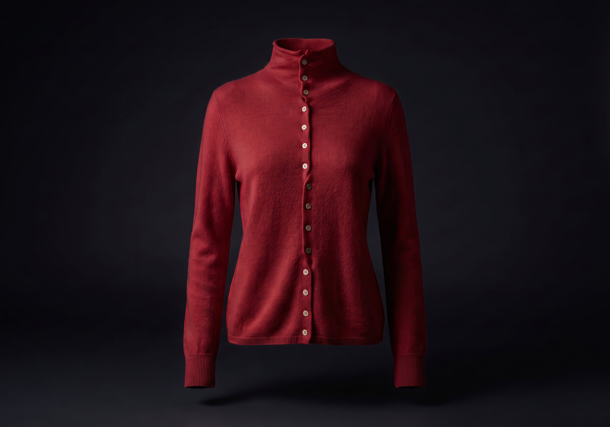 Velmurax mock neck cashmere cardigan in deep red, on its own on the dark studio set