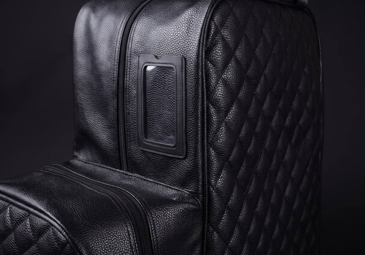 Velmurax quilted boot and helmet bag in black, the hardware and stitching up close