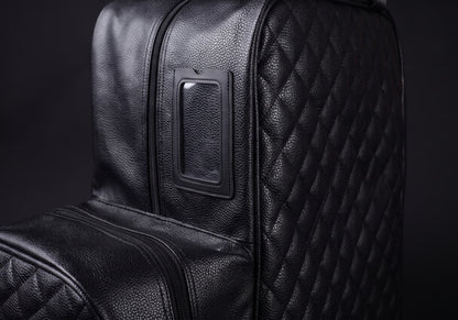 Velmurax quilted boot and helmet bag in black, the hardware and stitching up close