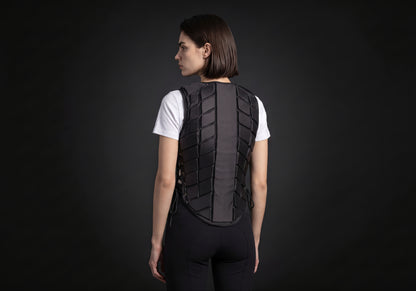 Velmurax riding body vest in black, seen from the back on the model, showing the back of the garment