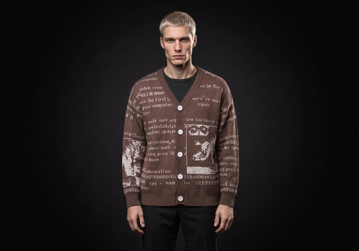Velmurax text jacquard cardigan in brown, worn by the model in a front view on the dark studio set