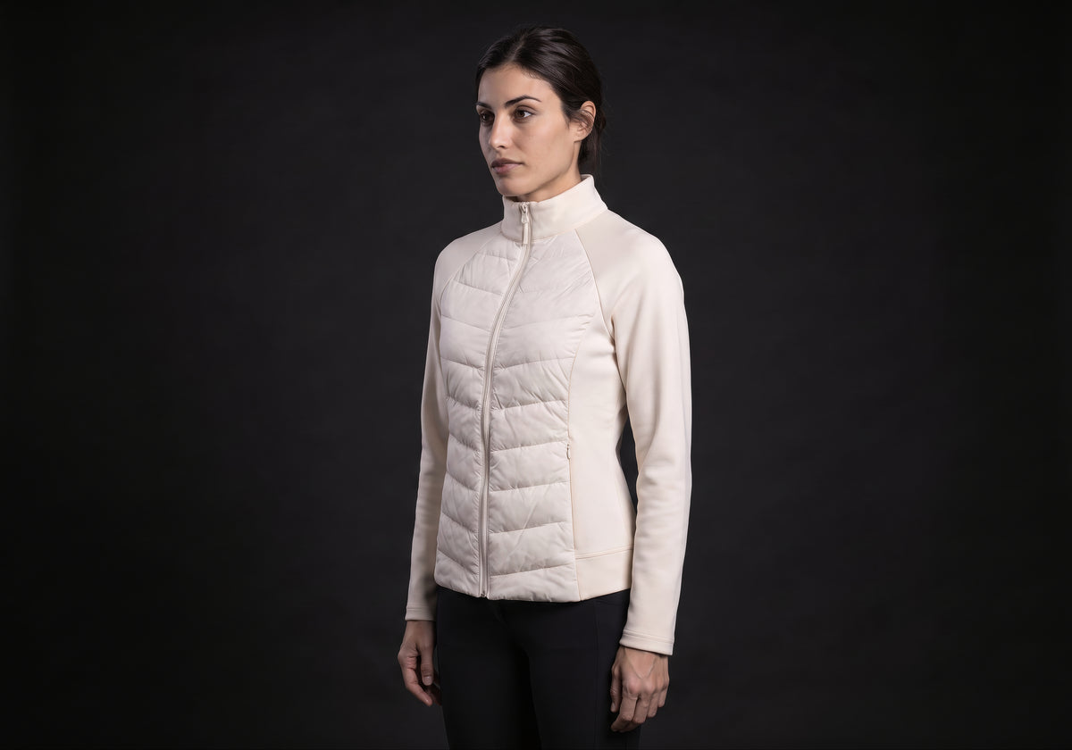 Velmurax women's down riding jacket in ivory, in a three-quarter view on the model on the studio set