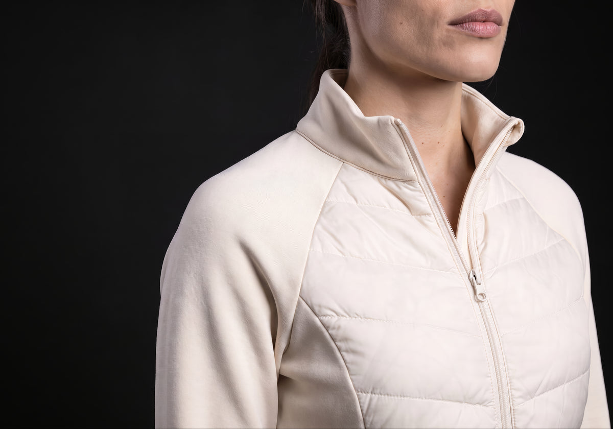 Velmurax women's down riding jacket in ivory, in a close detail shot on the model