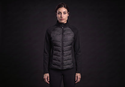 Velmurax women's down riding jacket in black, worn by the model in a front view on the dark studio set
