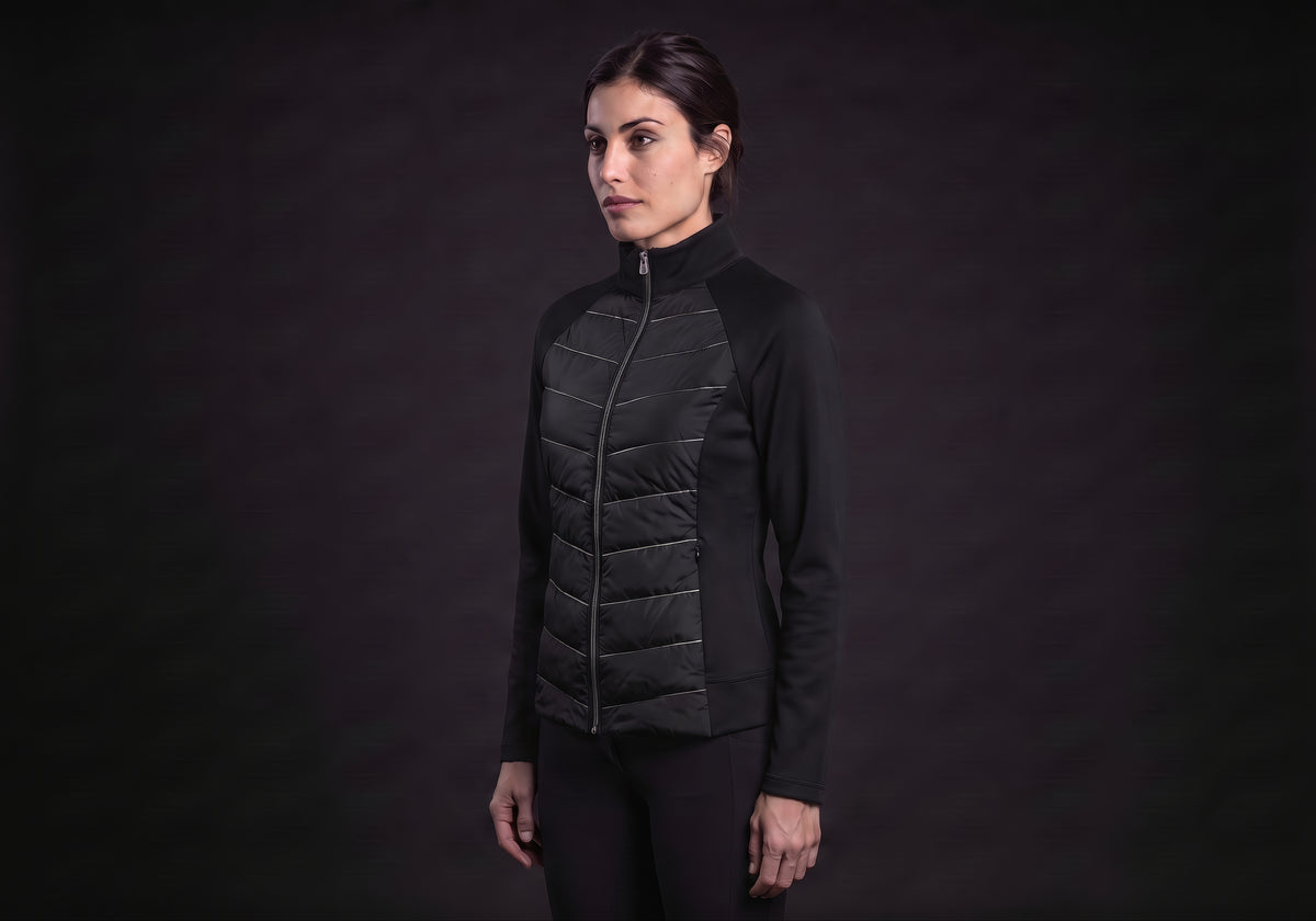 Velmurax women's down riding jacket in black, in a three-quarter view on the model on the studio set