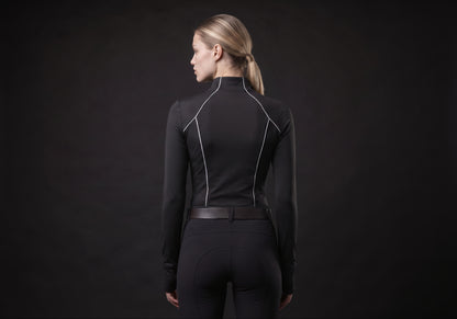 Velmurax women's long-sleeve riding top in black, seen from the back on the model, showing the back of the garment